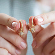 Crystal Star Huggie Hoops in Gold