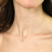Tiny Pearl Bow Pendant Necklace in Silver
